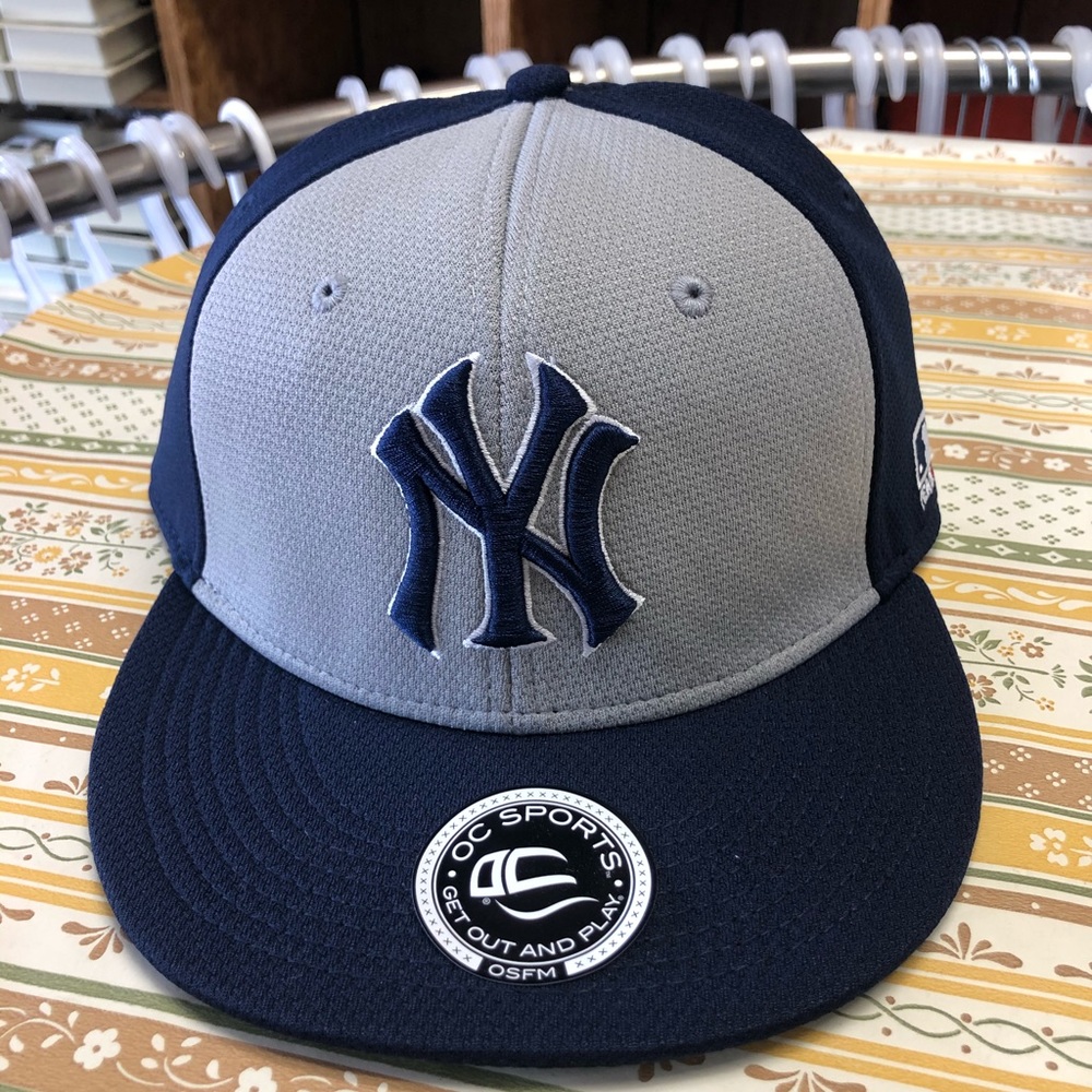 New York Yankees baseball cap.